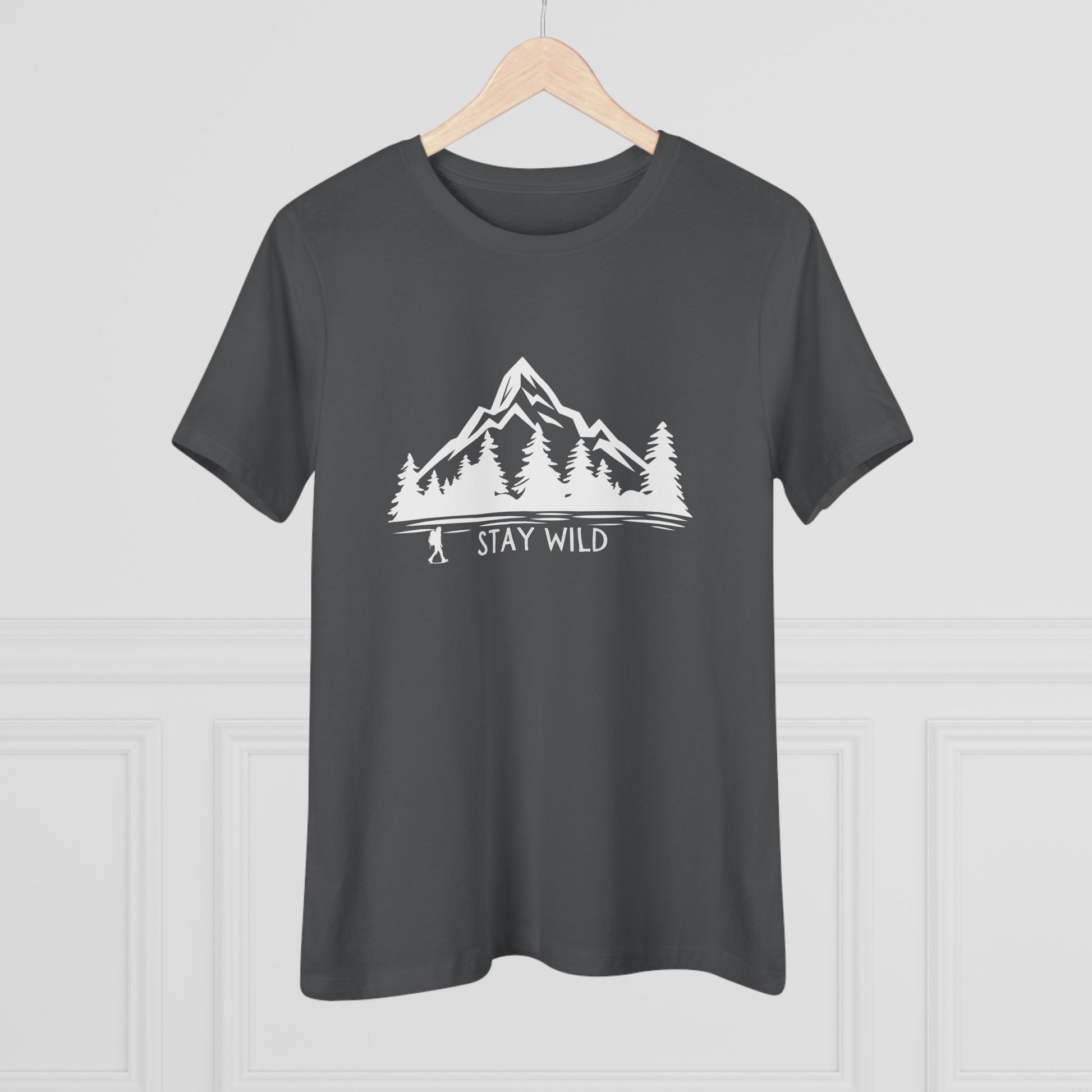Dark gray t-shirt with a white mountain and tree graphic and 'Stay Wild' text on a light gray background.