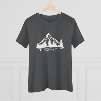 Dark gray t-shirt with a white mountain and tree graphic and 'Stay Wild' text on a light gray background.